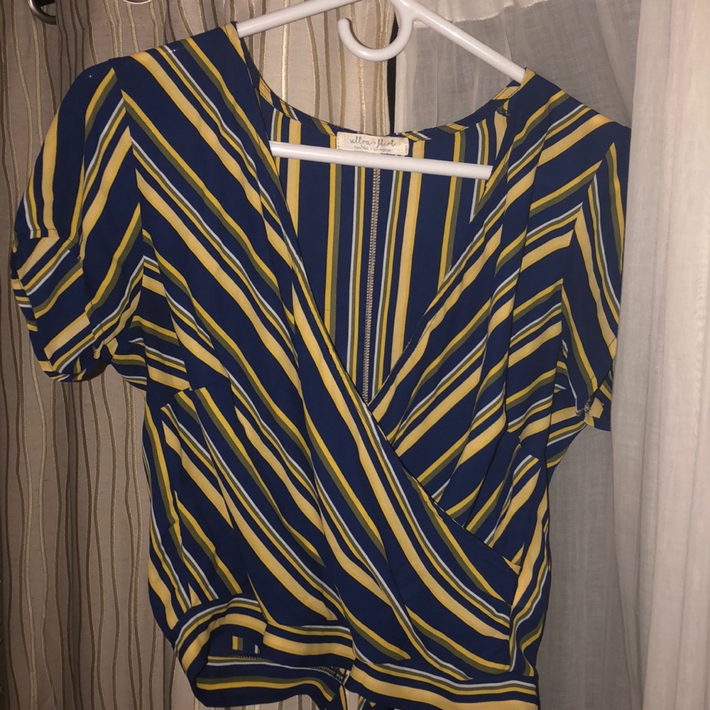 Wrap shirt. Able to tie however you’d like.